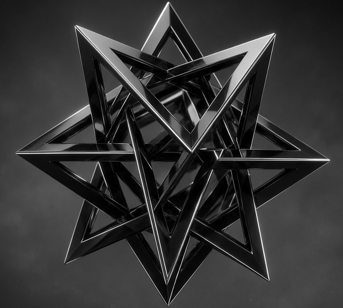 Polished black stellated polyhedron in soft grey light, the kind of geometry built with custom WebGL shaders
